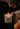 A close-up shot captures the moment someone lights the Arlow candle by Auden Lueur.