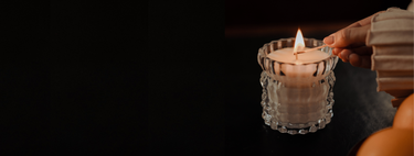 A close-up shot captures the moment someone lights the Arlow candle by Auden Lueur.