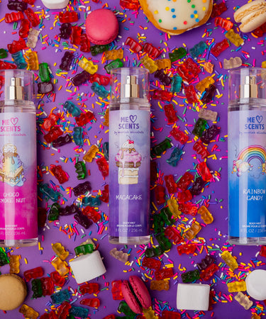 Discover the vibrant trio of ME Scents body mists by Moriah Elizabeth Beauty, showcased against a playful candy-inspired backdrop. Sweet, fun, and irresistible!